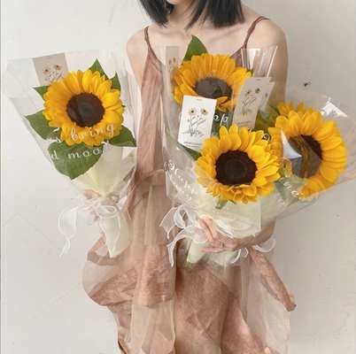 Ein guter Preis. Tag der Lehrer Englisch transparentes, wasserdichtes Cellophane aus Kunststoff, Blumenverpackungsmaterial Sonnenblumen-Bouquet-Packpapier Online
